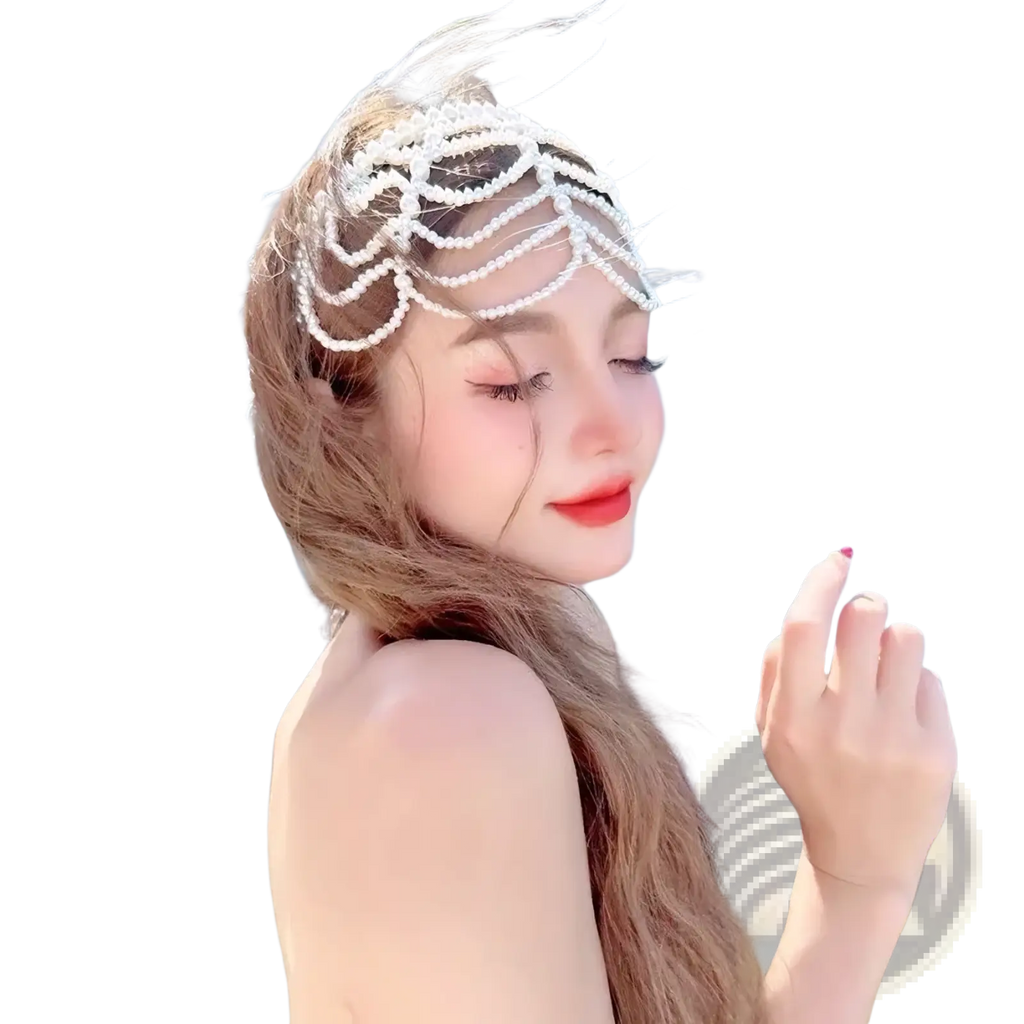 Pearl bridal crown hair band with delicate white pearl and cascading beadwork draping across forehead and temples