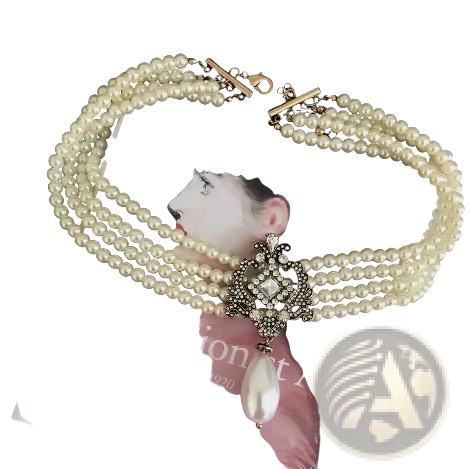Elegant cream-colored triple-strand pearl choker necklace with silver-toned diamond-encrusted pendant and teardrop pearl drop