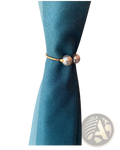 Gold-toned pearl curtain tieback with two round pearl-like beads and elegant alloy spring buckle closure