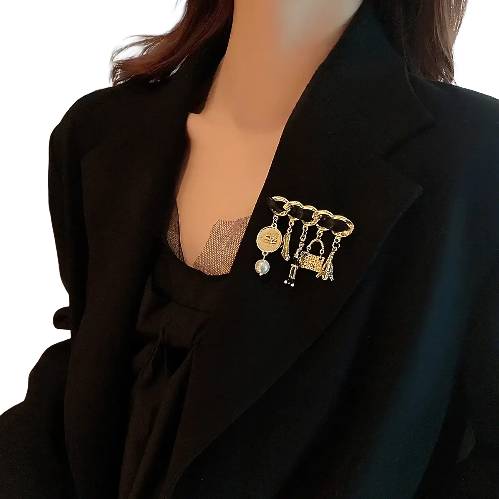 Pearl Flower Number 5 gold brooch pin featuring a gold-toned chain-link design with pearl coin and handbag charms