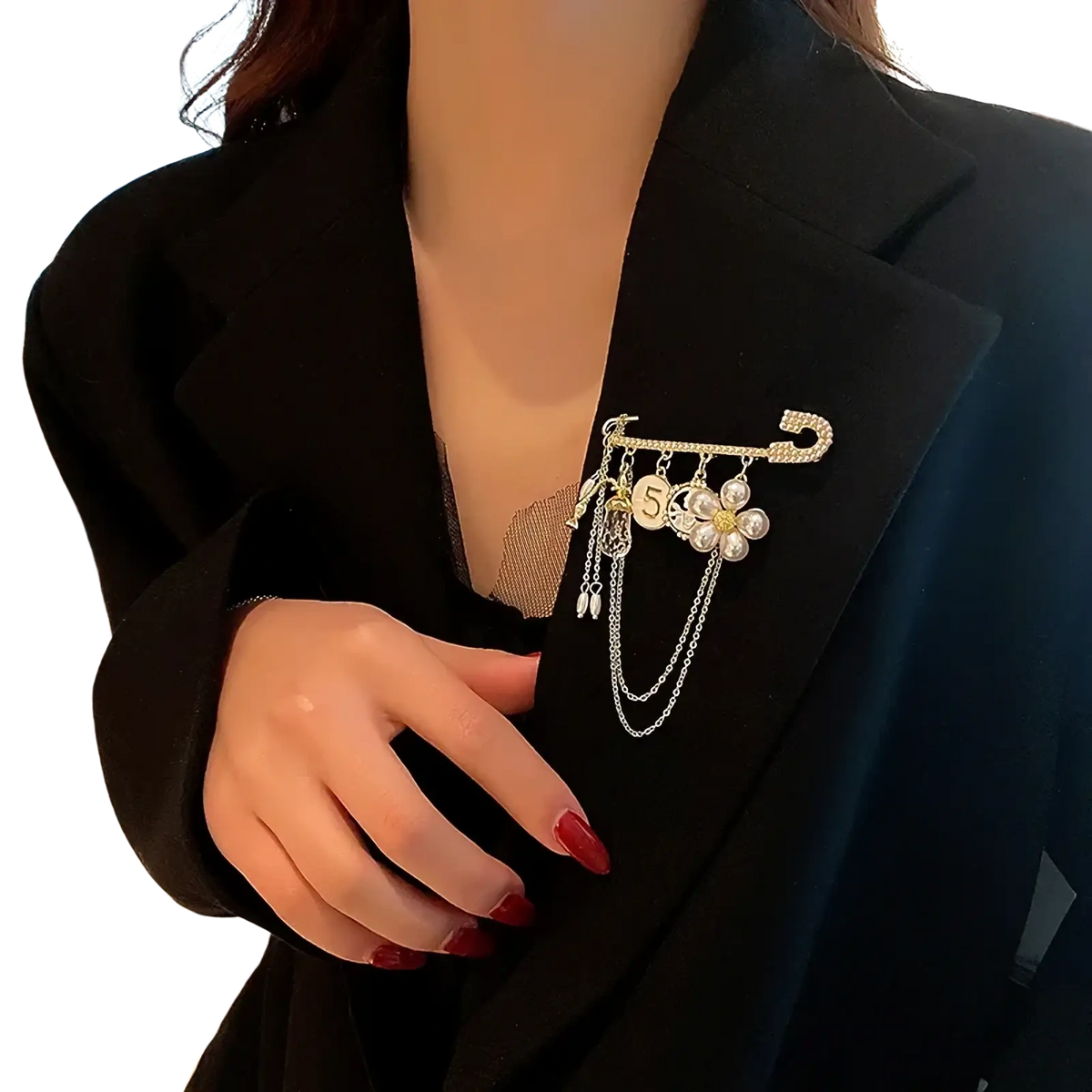 Gold-toned safety pin brooch with dangling pearl flower pendant and number 5 disc for elegant accessory styling