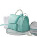 A delicate mint green paper handbag with a pearl handle and satin bow for party favor gift box candy packaging
