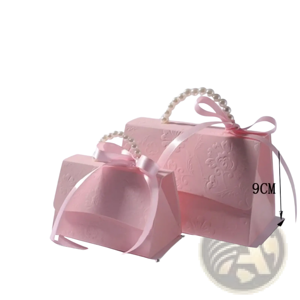 Pink satin-finish party favor gift boxes with embossed floral patterns pearl-handled straps and ribbon bows