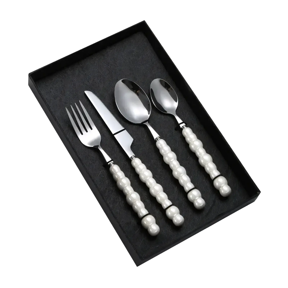 Elegant four-piece stainless steel cutlery set with pearl white beaded handles neatly arranged in a black gift box