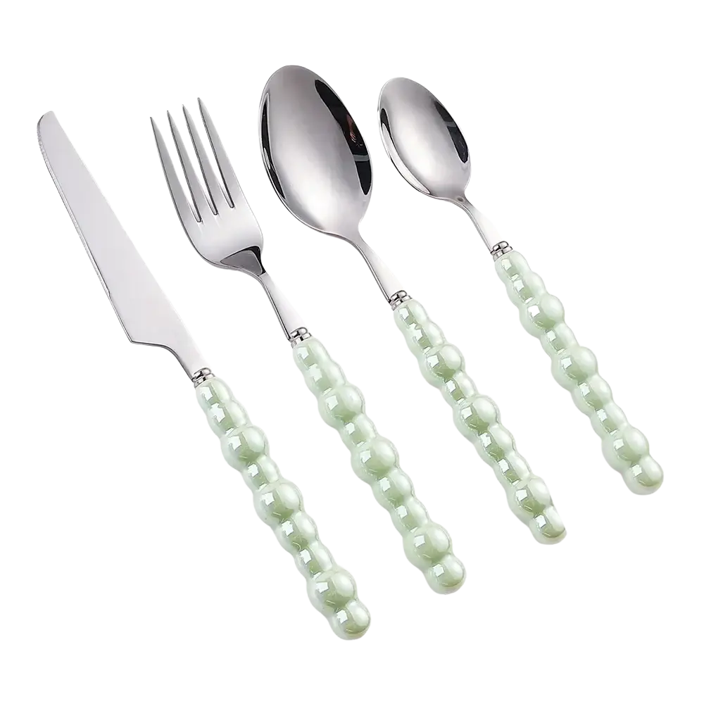 Set of four stainless steel cutlery with pale green beaded pearl handles for elegant dining use