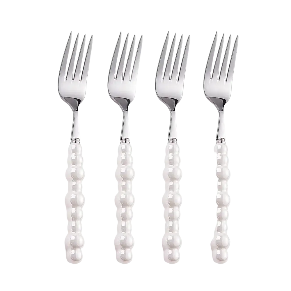 Set of four elegant stainless steel forks with pearl-like white beaded handles from the pearl handle cutlery set