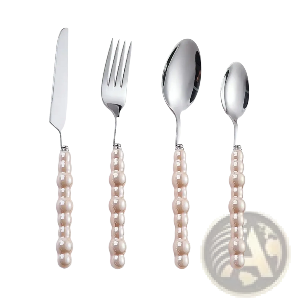 Set of four stainless steel cutlery pieces with pearl handle and polished heads for elegant dining