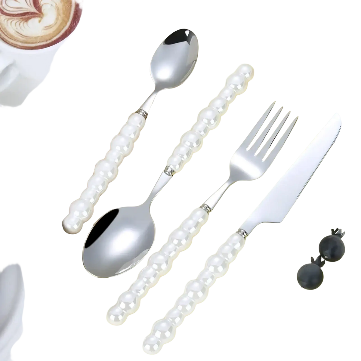 Elegant pearl handle stainless steel flatware set with spoon fork and knife on yellow surface