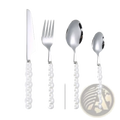 Set of four silver-toned stainless steel flatware pieces with pearl-like white beaded handles for elegant dining