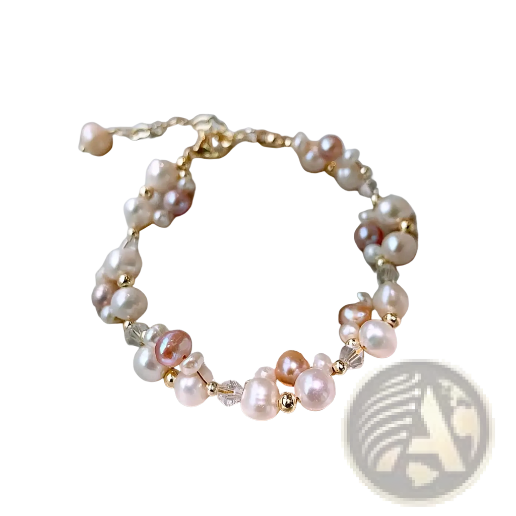 A delicate 14k gold filled bracelet with pink peach and white freshwater pearls and clear crystal beads