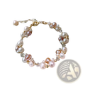 A delicate 14k gold filled bracelet with pink peach and white freshwater pearls and clear crystal beads