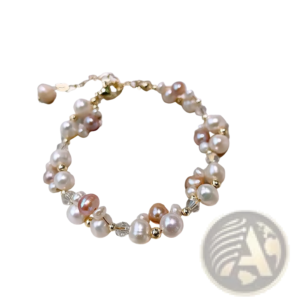 A delicate bracelet from pearl jewelry set with cream pink peach freshwater pearls and clear crystals on 14k gold filled chain