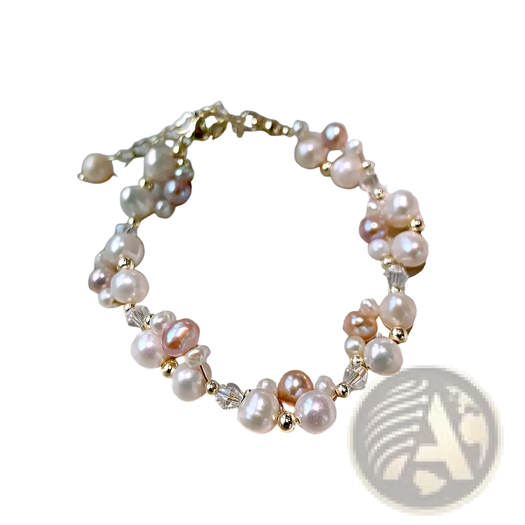 A delicate 14k gold filled pearl jewelry set with cream pink and white freshwater pearls and clear crystal beads
