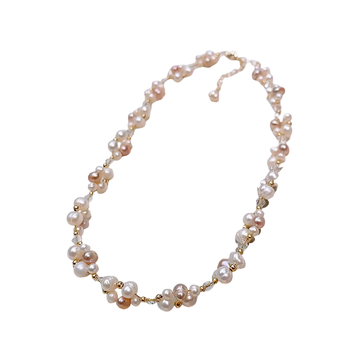 A delicate pearl jewelry set with mixed pink and white freshwater pearls and gold beads on a 14k gold filled chain