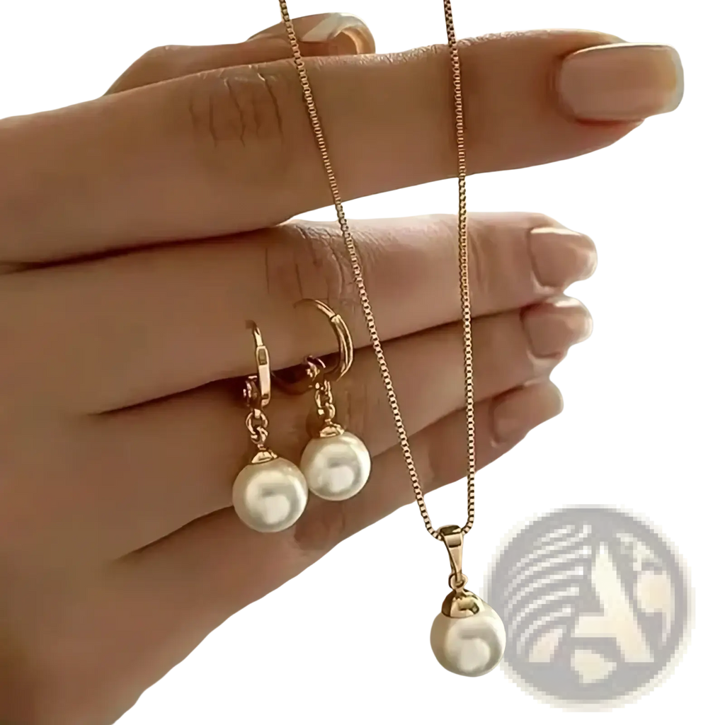 Gold-toned pearl jewelry set featuring a pendant necklace and matching hoop earrings with delicate chain links