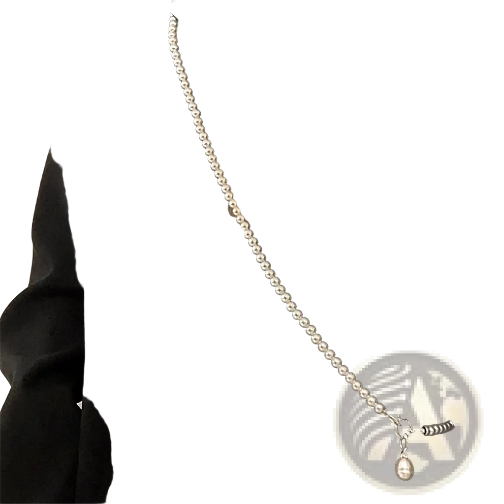 A delicate silver-toned pearl pendant long necklace with a teardrop-shaped crossbody strap accessory for women