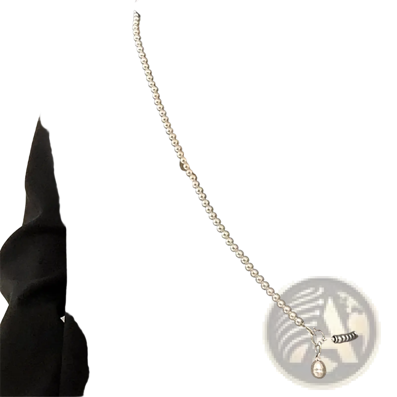 A delicate silver-toned pearl pendant long necklace with a teardrop-shaped crossbody strap accessory for women