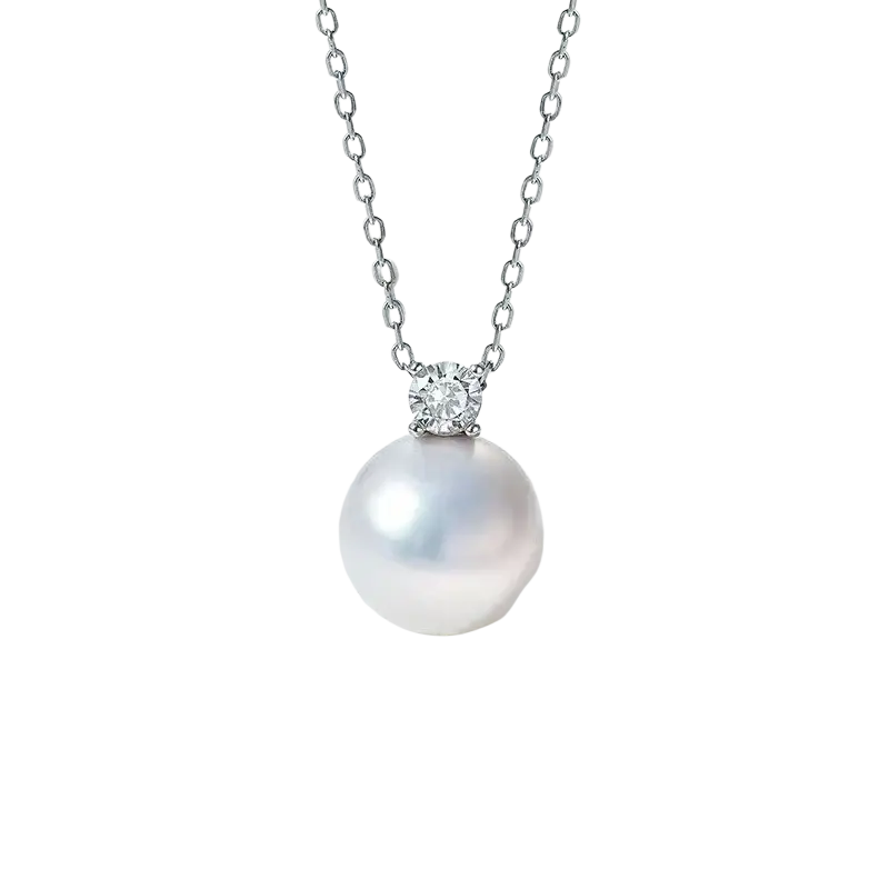 A lustrous white pearl pendant necklace with a single round diamond set in silver-toned metal