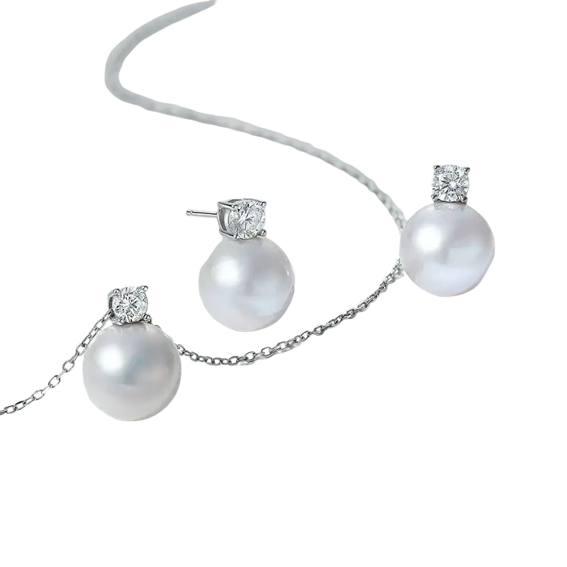 Lustrous white freshwater pearl earrings with diamond accents set in sleek silver-toned metal for elegant wear