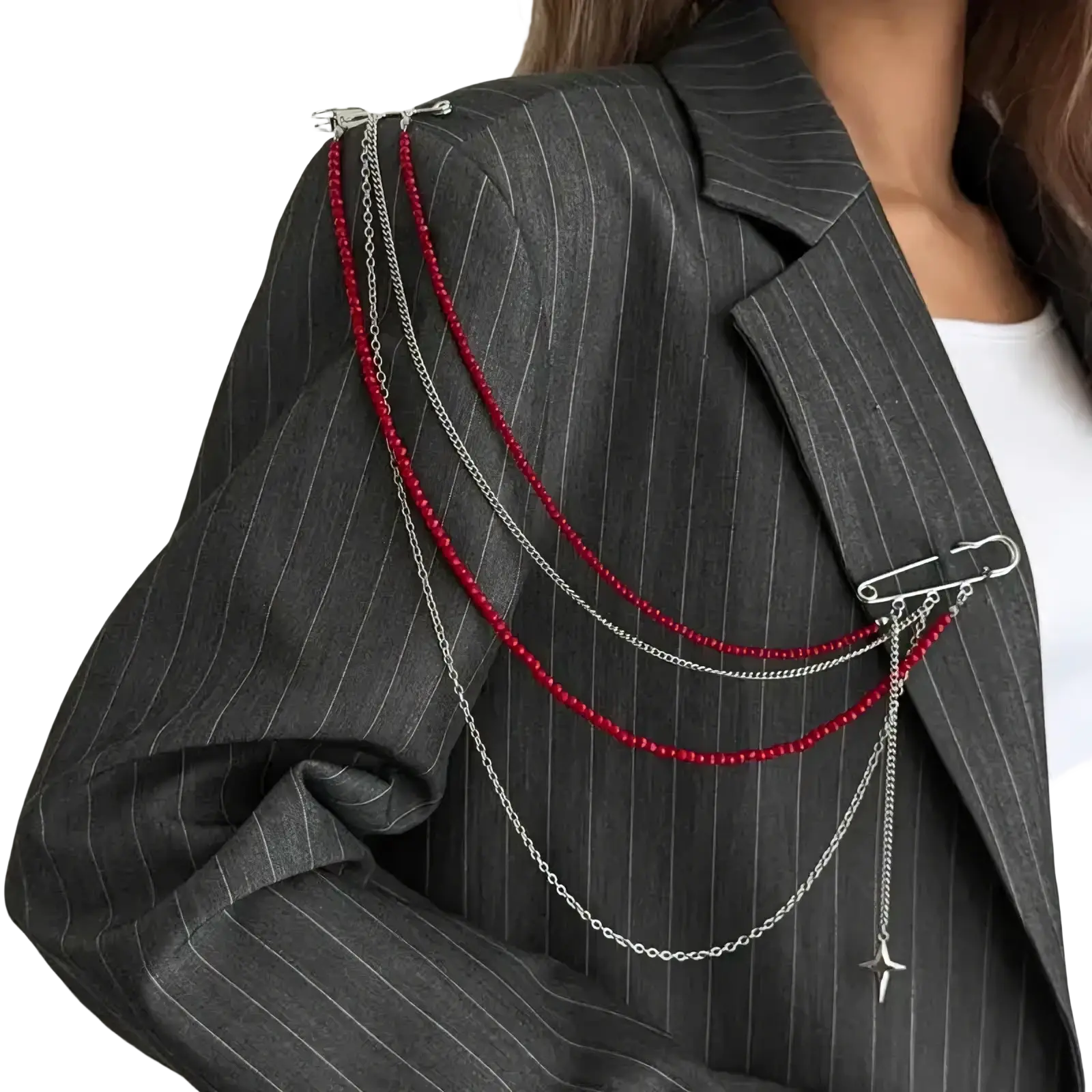 Pearl tassel chain brooch with silver chain, red beads, and airplane charm pinned on a pinstripe blazer shoulder