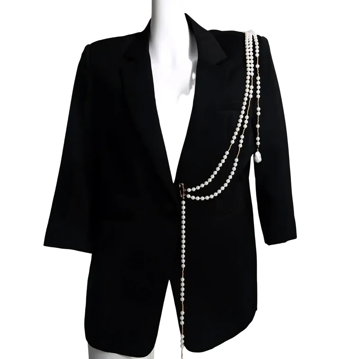 Elegant multi-strand pearl tassel chain brooch with gold-tone clasp draped on black blazer shoulder and torso