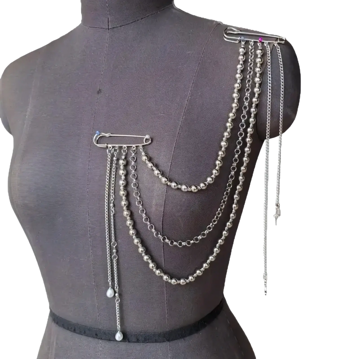 Pearl tassel chain brooch in silver featuring layered beaded and link chains with gemstone-adorned safety pins