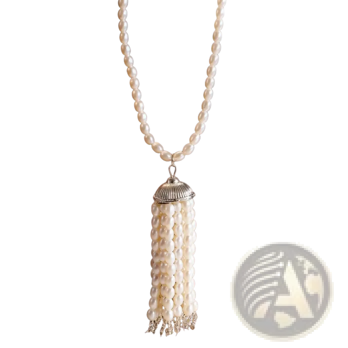 Pearl tassel pendant necklace featuring cream-colored pearls and silver-toned fluted cap with crystal accents