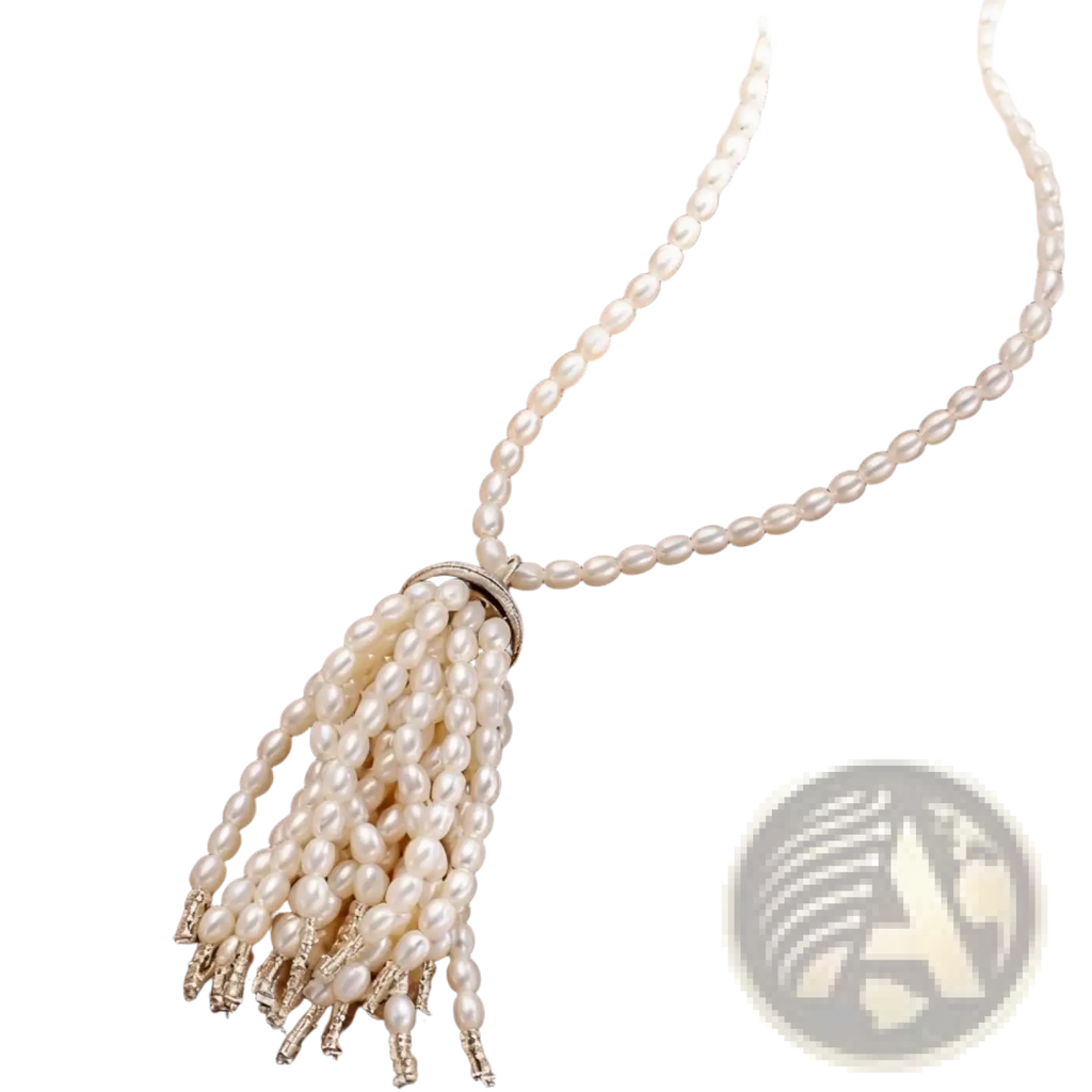 Elegant white pearl tassel pendant necklace with silver-toned clasp and delicate beaded detailing for long sweater chain