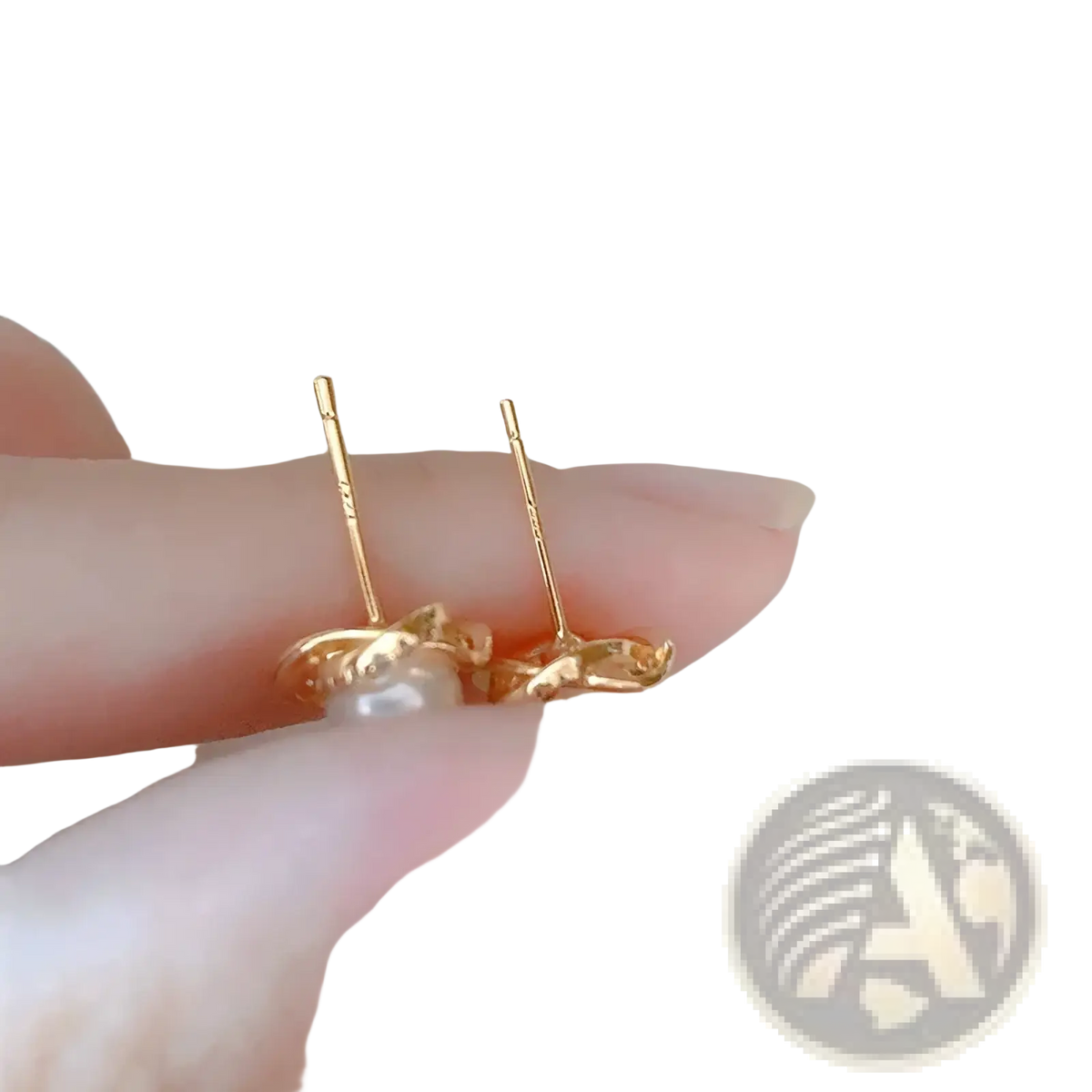 Pearl twist gold stud earrings featuring a delicate twisted gold design with a single pearl center