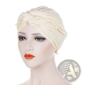 Cream-colored satin turban hijab for women adorned with delicate pearl embellishments in a pearl velvet style
