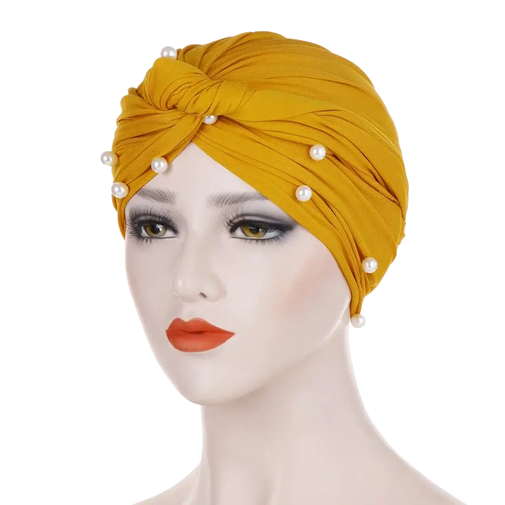 Golden velvet turban hijab for women adorned with white pearls showcasing elegant traditional design