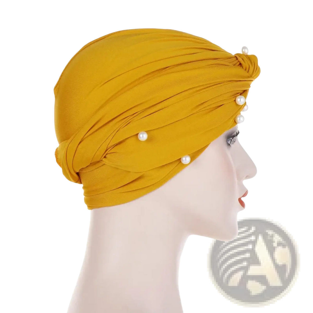 A mustard yellow pearl velvet turban hijab for women with a twisted knot and pearl embellishments