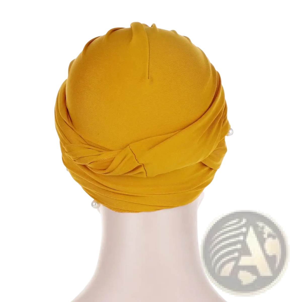 A vibrant mustard-yellow pearl velvet turban hijab for women with soft draped fabric and subtle pearl accents