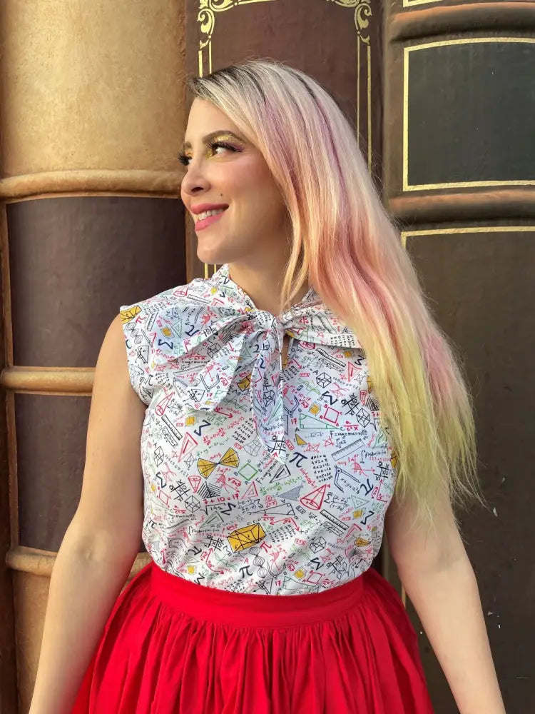 White sleeveless blouse with colorful math symbols and bow neckline paired with peggy red cotton midi swing skirt with pockets