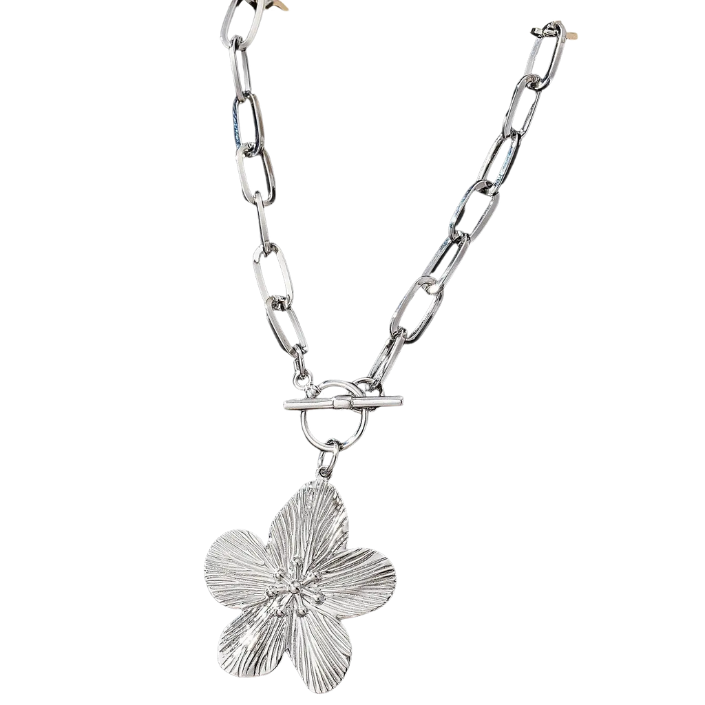 Silver pendant necklace with vintage wisteria flower featuring textured petals and a central gemstone accent