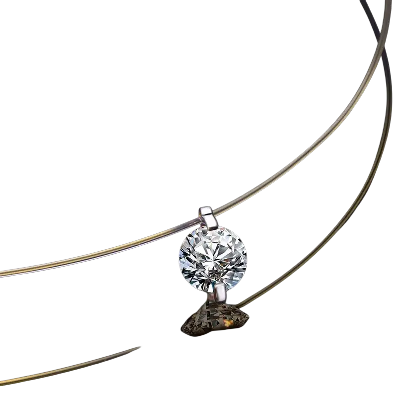 A simple round single sparkling rhinestone pendant necklace in silver on a delicate chain perfect for everyday wear