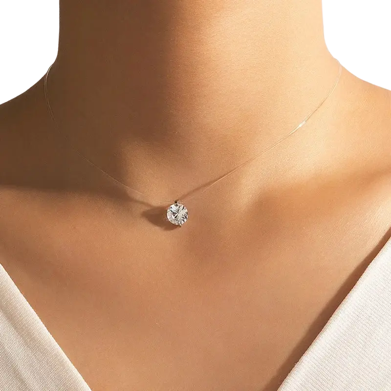 A delicate silver pendant necklace featuring a simple round single round single rhinestone choker pendant