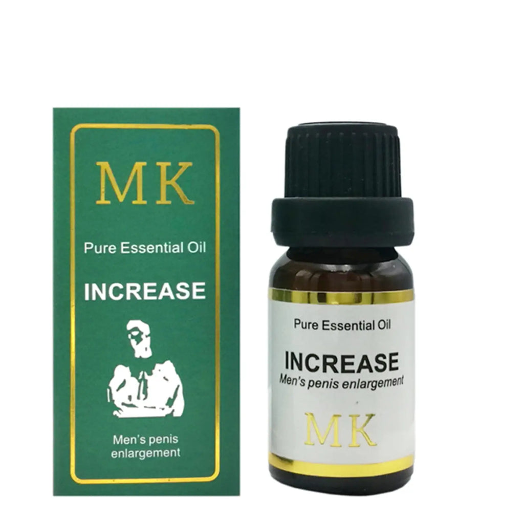 Dark amber glass bottle with black ribbed cap and gold-trimmed white label of pure essential oil for penis enlargement