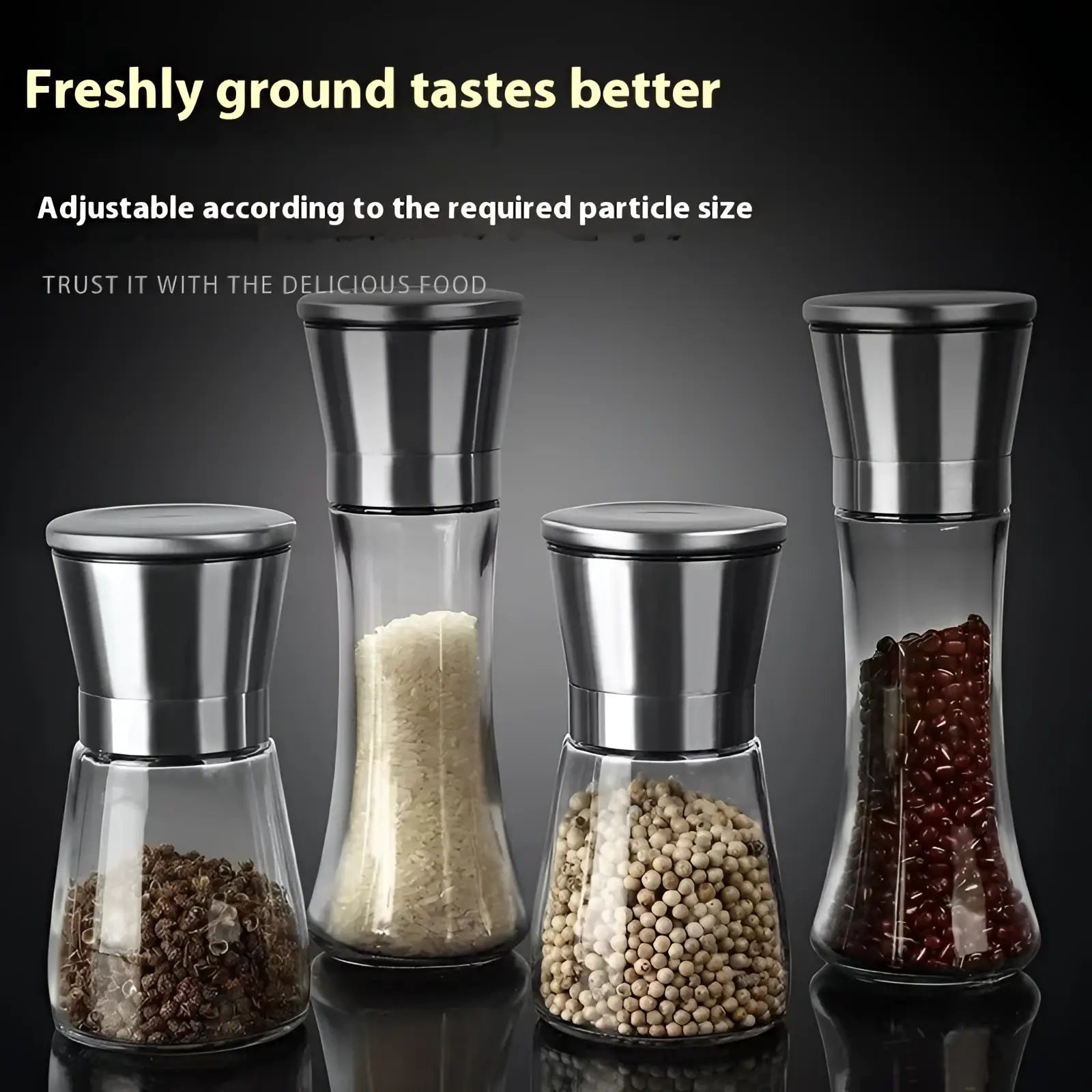 Set of four transparent glass pepper grinders with stainless steel tops and adjustable grinding mechanisms