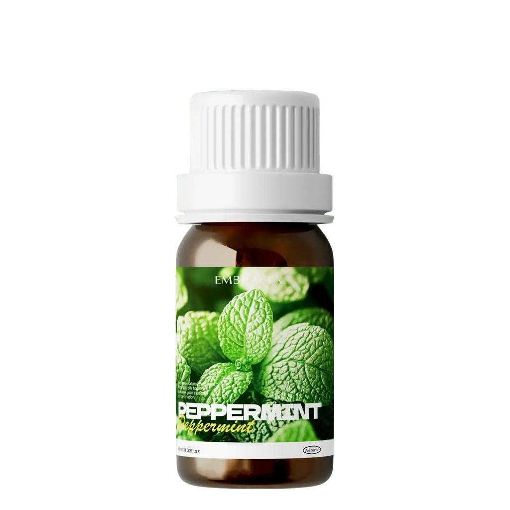 A small amber glass bottle of embracex peppermint essential oil 10ml for skin and hair care with white cap and green leaves label