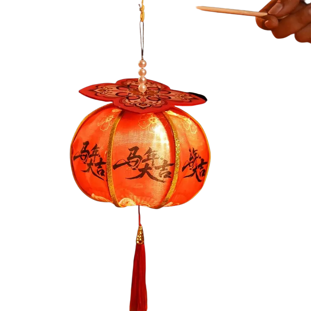 A persimmon lantern chinese new year led decor glowing red with gold trim black chinese characters and pearl flower top