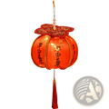 A glowing red persimmon lantern with gold trim, embroidered floral patterns, and chinese new year led decor features peace and joy characters