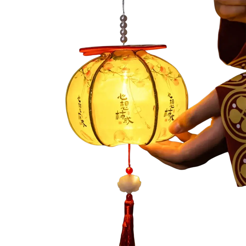 A warm glowing persimmon lantern with peach blossom illustrations and Chinese calligraphy on translucent paper panels