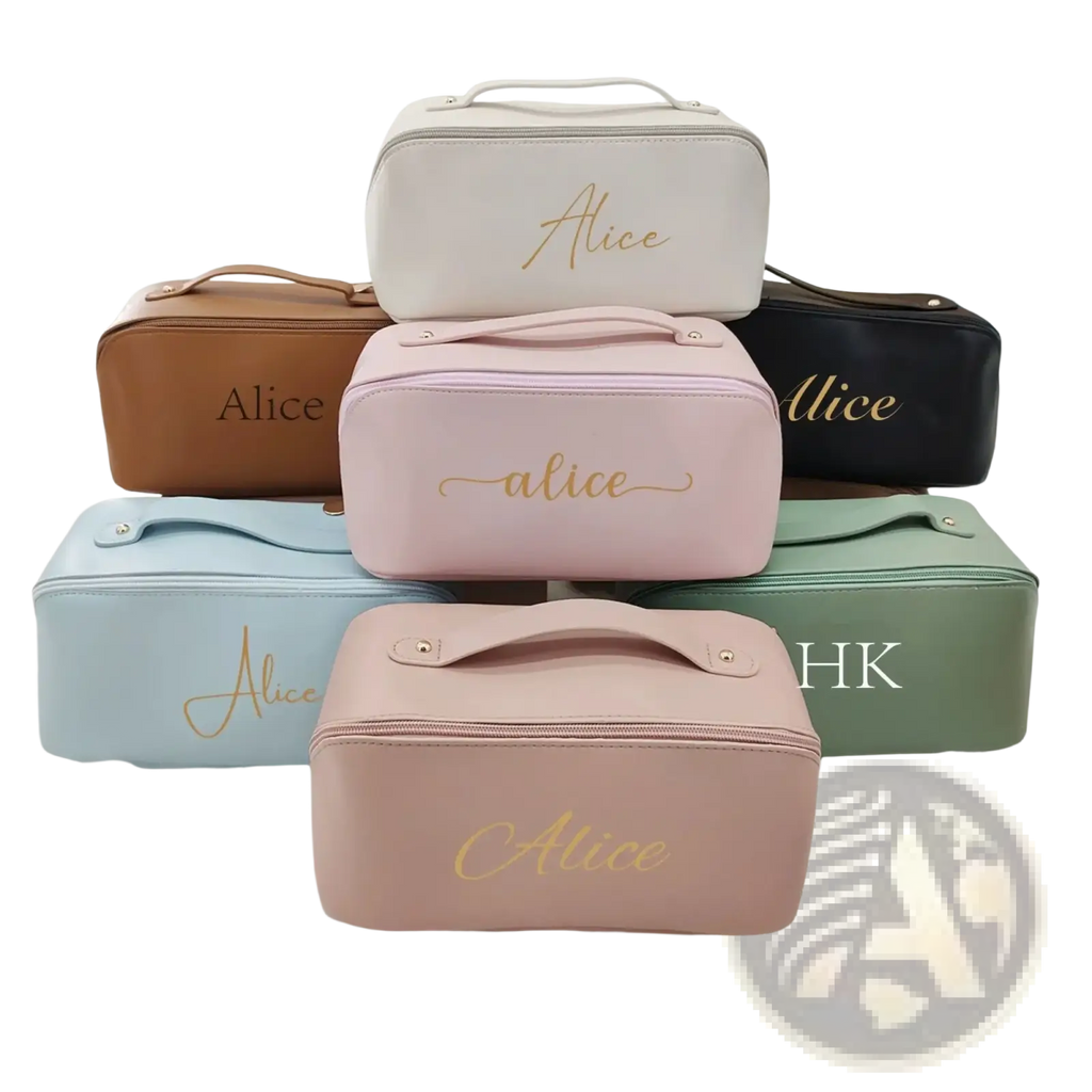 A collection of pastel and neutral personalized makeup bags with gold script names made from smooth faux leather