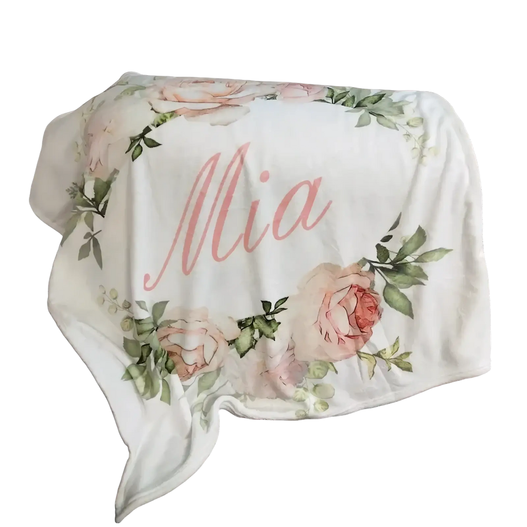 Personalized baby swaddle blanket fleece white with pink rose floral design and name mia in cursive script