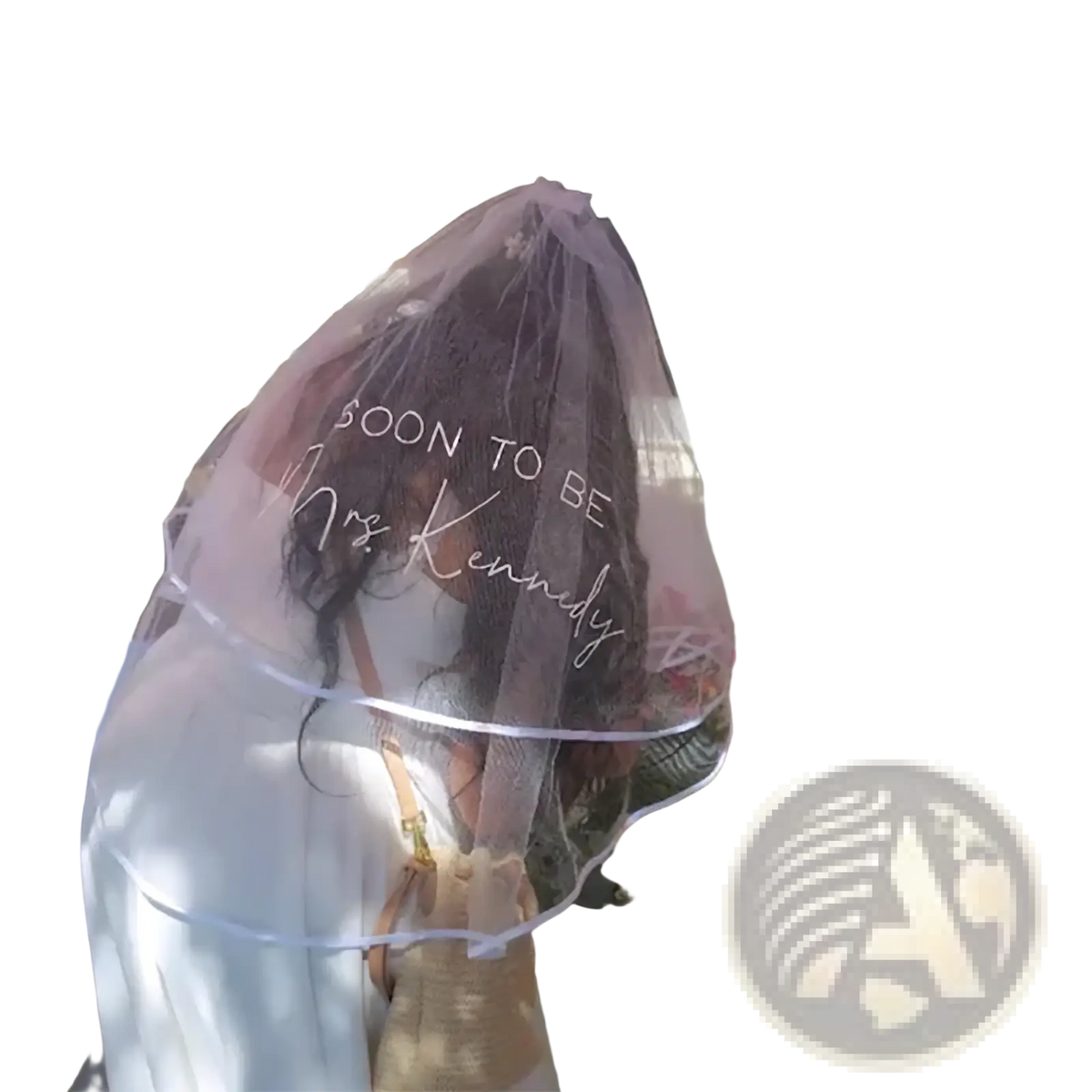 A delicate translucent pink personalized bachelorette party veil with soon to be mrs for bridal shower use
