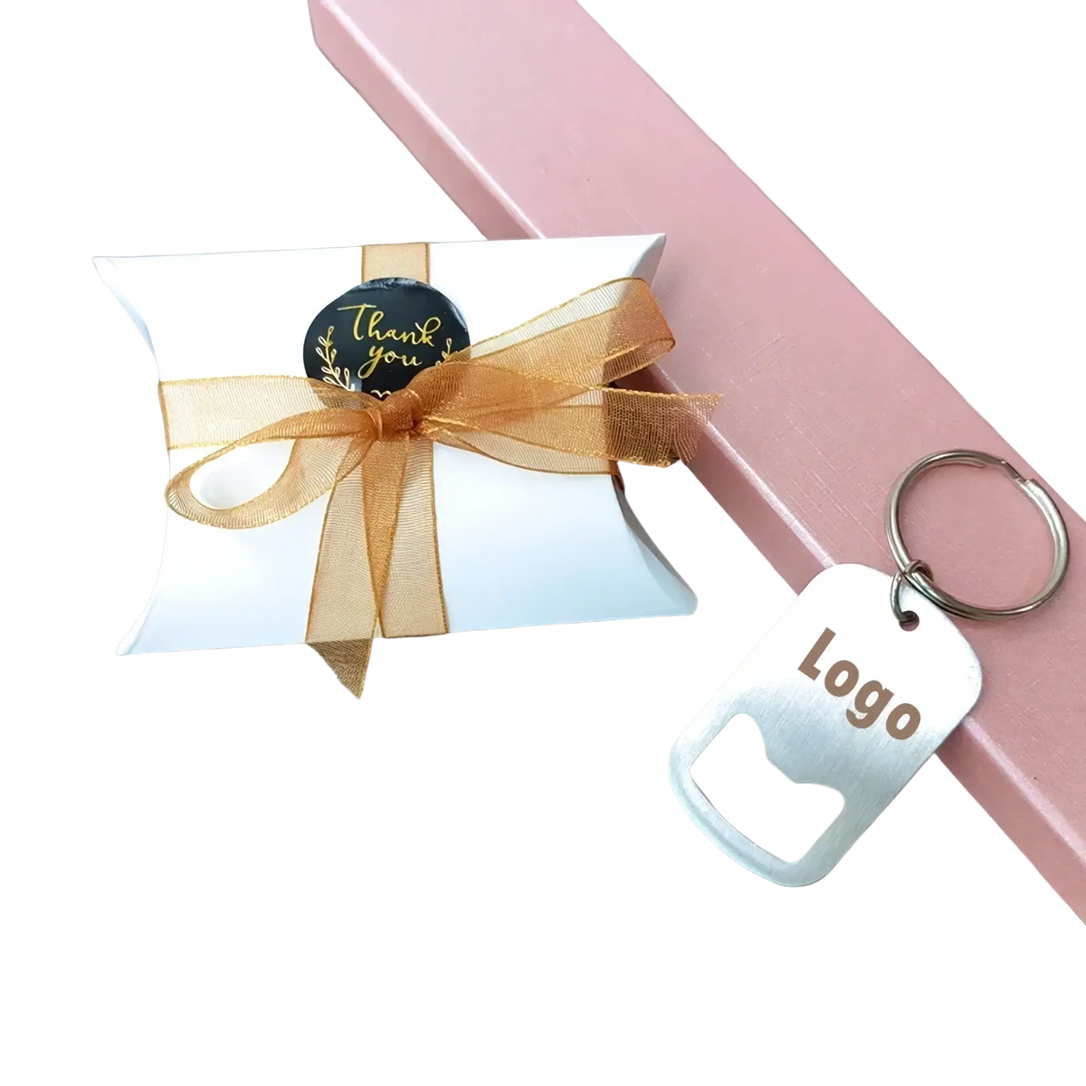 White paper gift box with gold sheer ribbon and black thank you sticker for personalized wedding favor bottle opener keychains