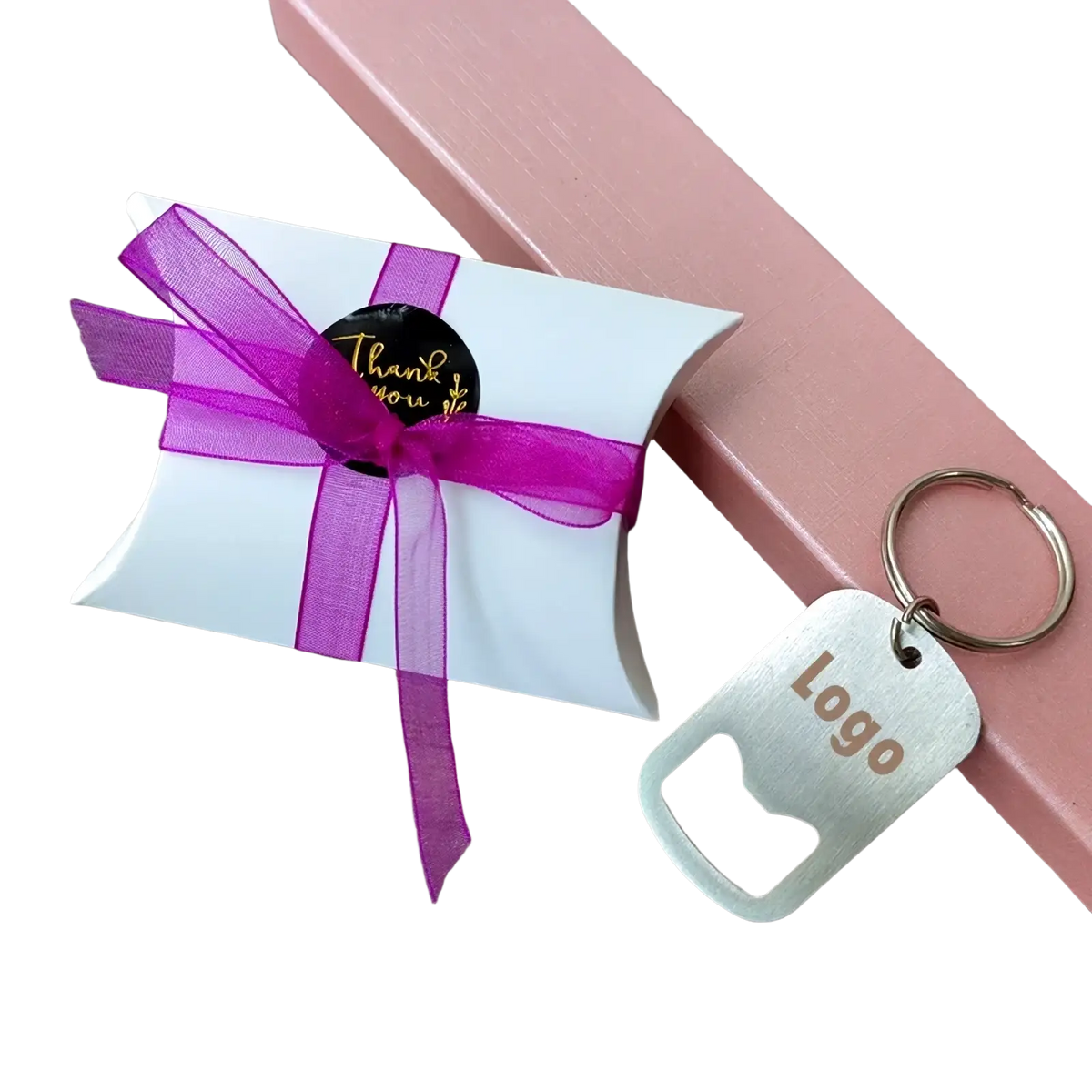White paper gift box with purple sheer ribbon and black thank you sticker for personalized wedding favor bottle opener keychains