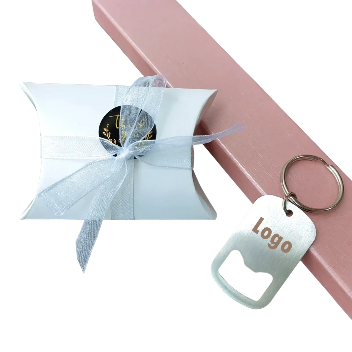 White paper gift box with sheer silver ribbon and black sticker with gold lettering for personalized wedding favor keychains