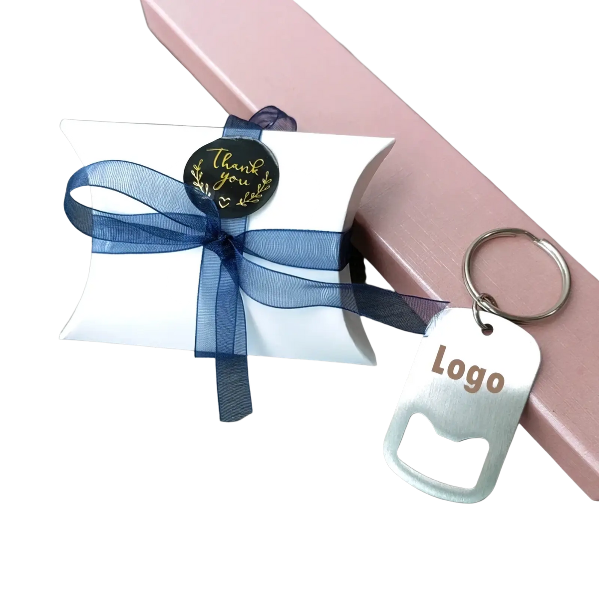 Personalized bottle opener keychains packaged in a white gift box with navy blue sheer ribbon and thank you sticker